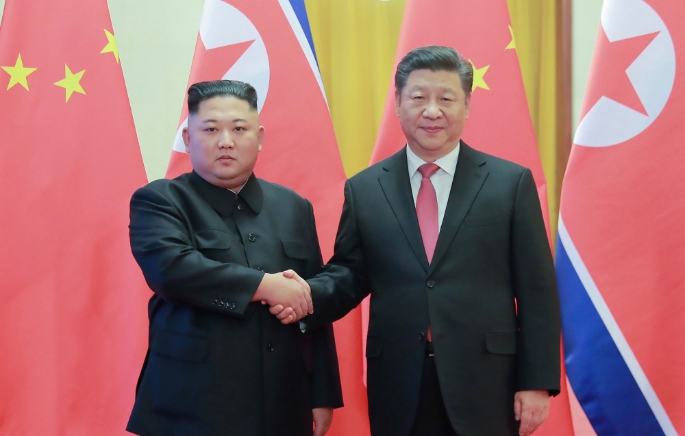 North Korea's leader Kim Jong Un, left, shakes hands with China's President Xi Jinping during a welcome ceremony at the Great Hall of the People in Beijing in this Jan. 8, 2019 file photo. — AFP