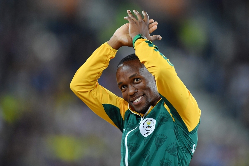 In this file photo taken on April 10, 2018, Gold medalist South Africa's Akani Simbine reacts during the athletics men's 100m final medal ceremony during the 2018 Gold Coast Commonwealth Games at the Carrara Stadium on the Gold Coast.  — AFP