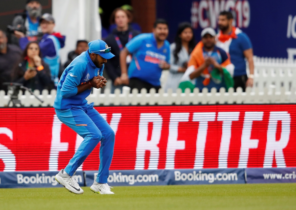 India's Vijay Shankar celebrates after the dismissal of Pakistan's Imam-ul-Haq during the 2019 Cricket World Cup group stage match at Old Trafford in Manchester, northwest England, on Sunday. — AFP