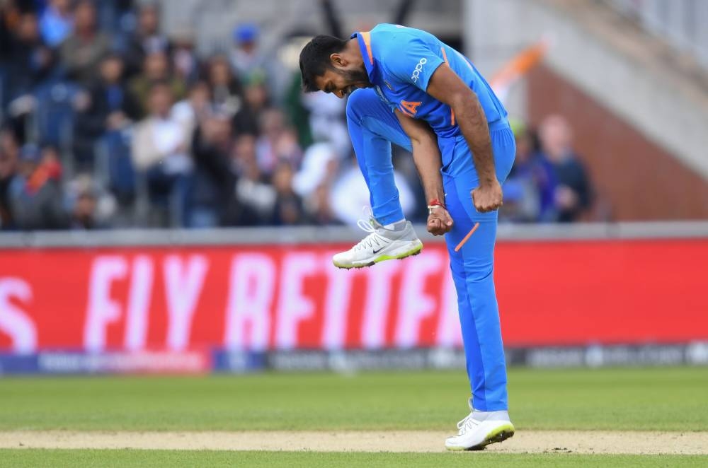 India's Vijay Shankar celebrates after the dismissal of Pakistan's Imam-ul-Haq during the 2019 Cricket World Cup group stage match at Old Trafford in Manchester, northwest England, on Sunday. — AFP