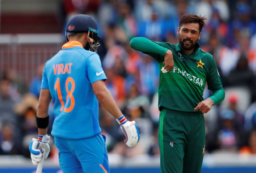 Pakistan's Mohammad Amir and India's Virat Kohli during the ICC Cricket World Cup match at Emirates Old Trafford, Manchester, Britain, on Sunday. — Reuters