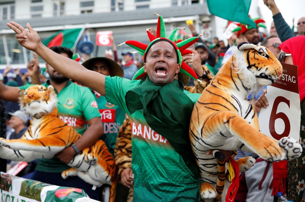 Bangladesh's Shakib Al Hasan and Liton Das celebrate winning the the ICC Cricket World Cup match against West Indies at The County Ground, Taunton, Britain, on Monday. — Reuters