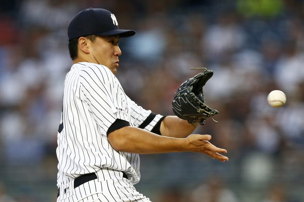 Masahiro Tanaka No. 19 of the New York Yankees pitches against the Tampa Bay Rays during the third inning at Yankee Stadium on Monday in the Bronx borough of New York City. — AFP