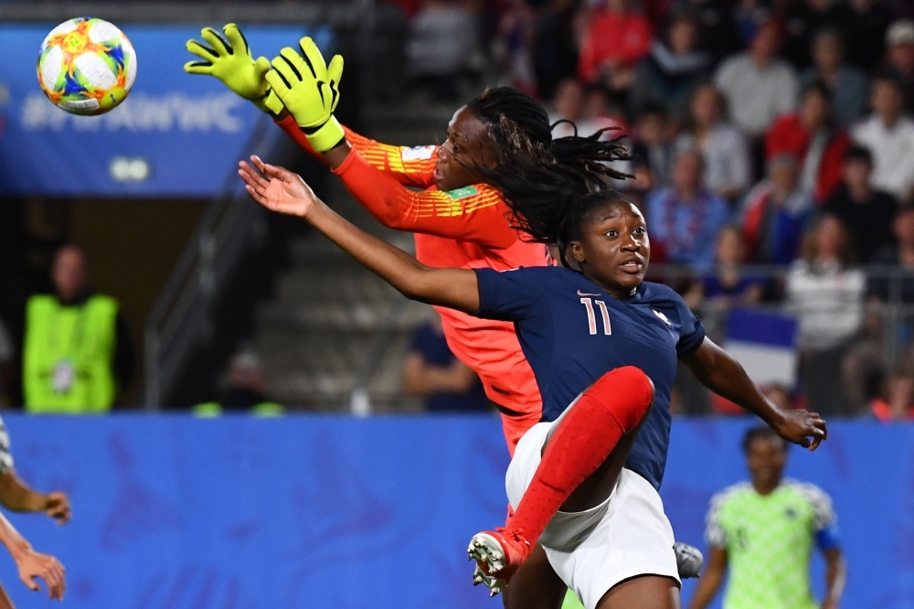 France's forward Kadidiatou Diani (R) vies for the ball with Nigeria's goalkeeper Chiamaka Nnadozie during the France 2019 Women's World Cup Group A football match on Monday at the Roazhon Park stadium in Rennes, western France. — AFP