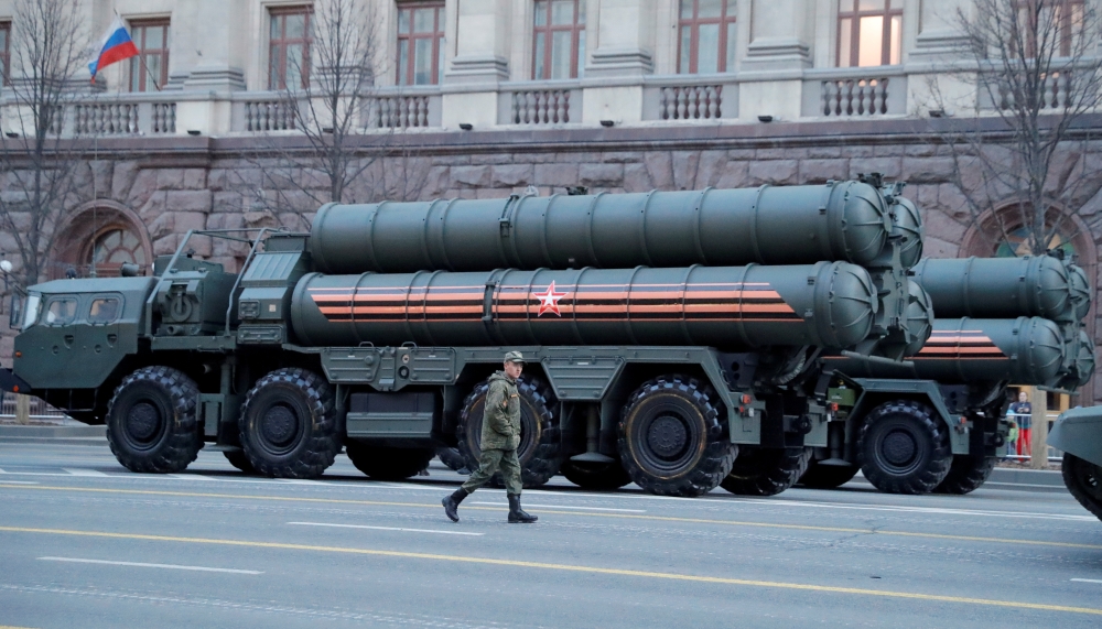 A Russian serviceman walks past S-400 missile air defense systems before a parade marking the anniversary of the victory over Nazi Germany in World War II, in central Moscow, Russia, in this April 29, 2019 file photo. — Reuters