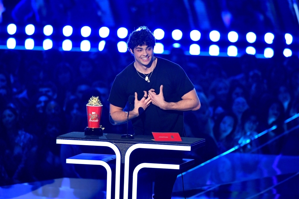 Noah Centineo accepts the Best Breakthrough Performance award for 'To All the Boys I've Loved Before' onstage during the 2019 MTV Movie and TV Awards at Barker Hangar in Santa Monica, California. — AFP