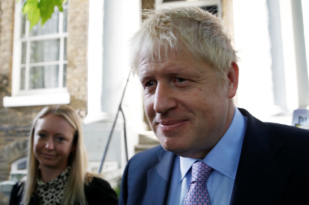 PM hopeful Boris Johnson leaves his home in London on Monday. — Reuters