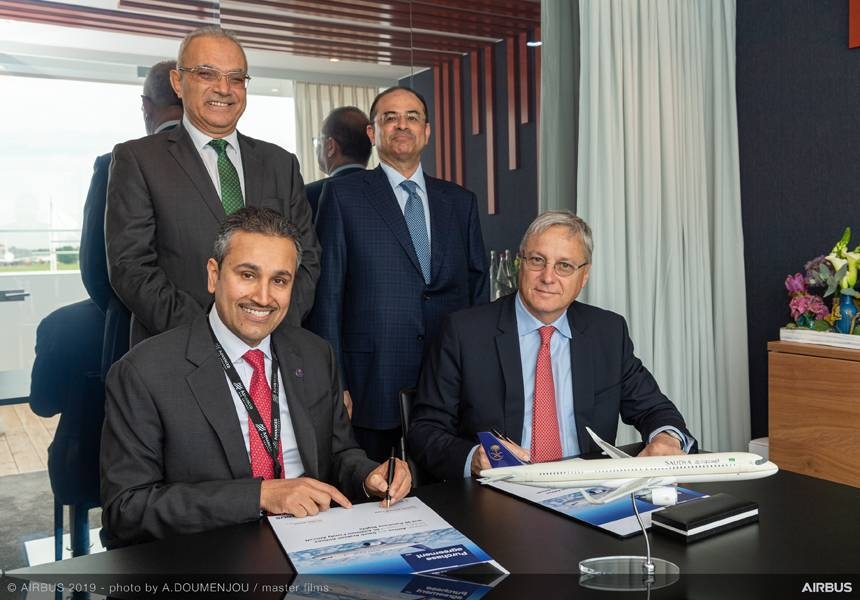 Eng. Saleh bin Nasser Al-Jasser, Director General of Saudi Arabian Airlines (left), and Christian Scherer, Airbus Chief Commercial Officer, sign the purchase agreement