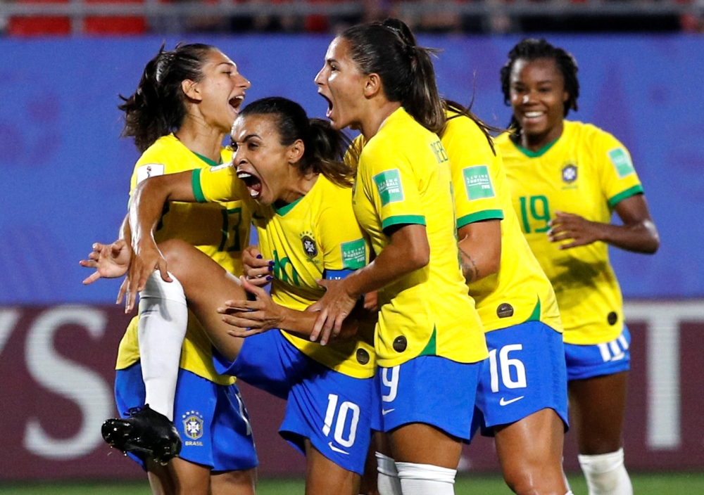 Brazil's Marta celebrates scoring their first goal with teammates during the Women's World Cup Group C match against Italy at the Stade du Hainaut, Valenciennes, France, on Tuesday. – Reuters