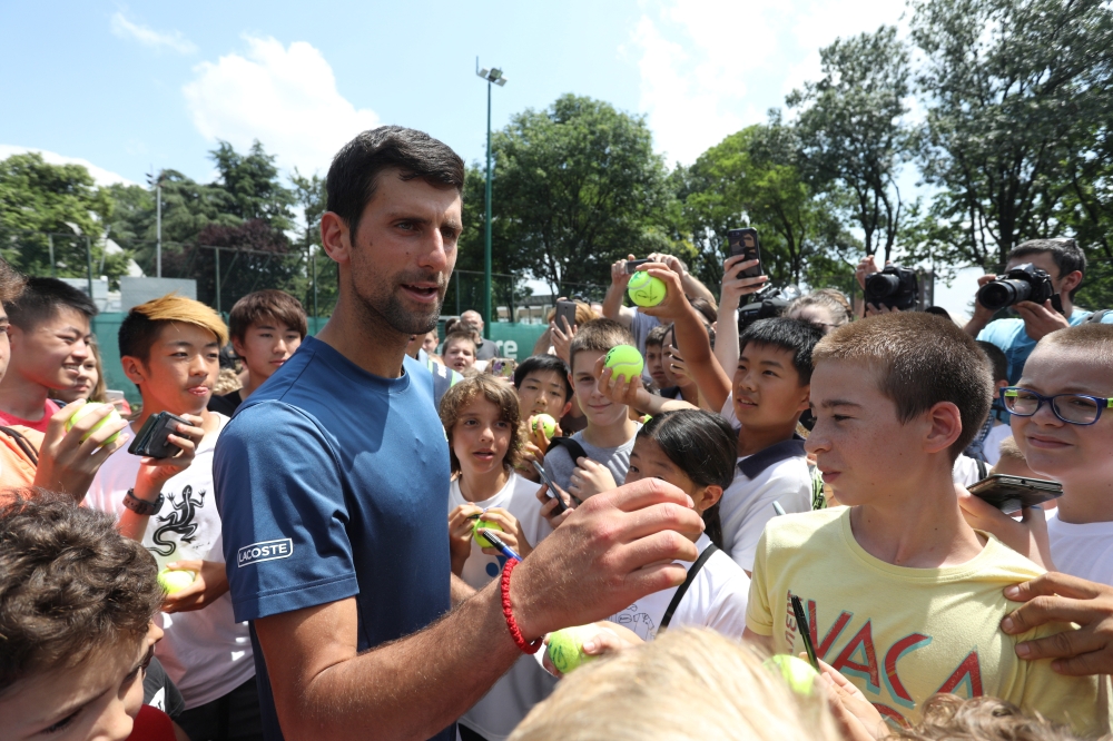 Novak Djokovic of Serbia meets with fans during a training session in Belgrade, Serbia, on Wednesday. — Reuters