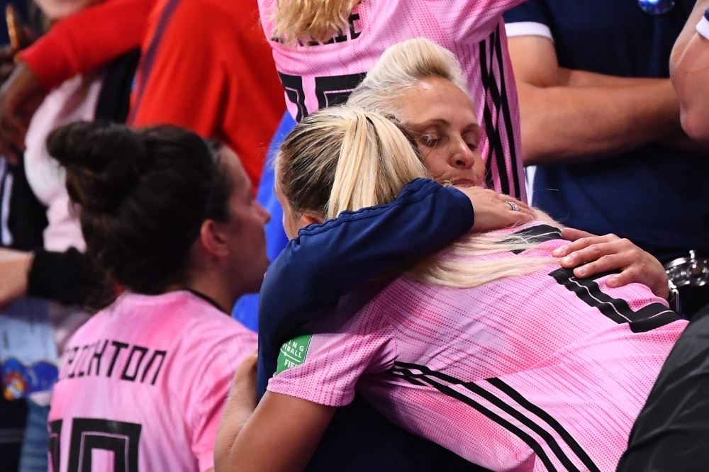 Scotland's coach Michelle Kerr comforts players at the end of the France 2019 Women's World Cup Group D football match between Scotland and Argentina, on Wednesday, at the Parc des Princes stadium in Paris. —  AFP