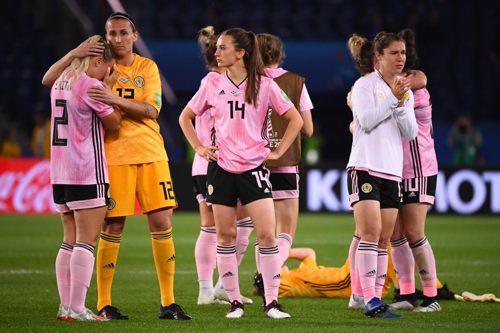 Scotland's coach Michelle Kerr comforts players at the end of the France 2019 Women's World Cup Group D football match between Scotland and Argentina, on Wednesday, at the Parc des Princes stadium in Paris. —  AFP