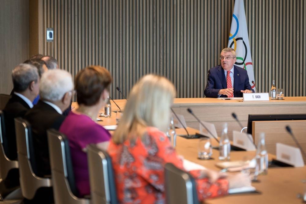 A picture taken on Tuesday in Lausanne shows International Olympic Committee (IOC) president Thomas Bach (R) attending a meeting of the IOC executive board in the new headquarters that will be inaugurated on June 23, 2019.  — AFP 