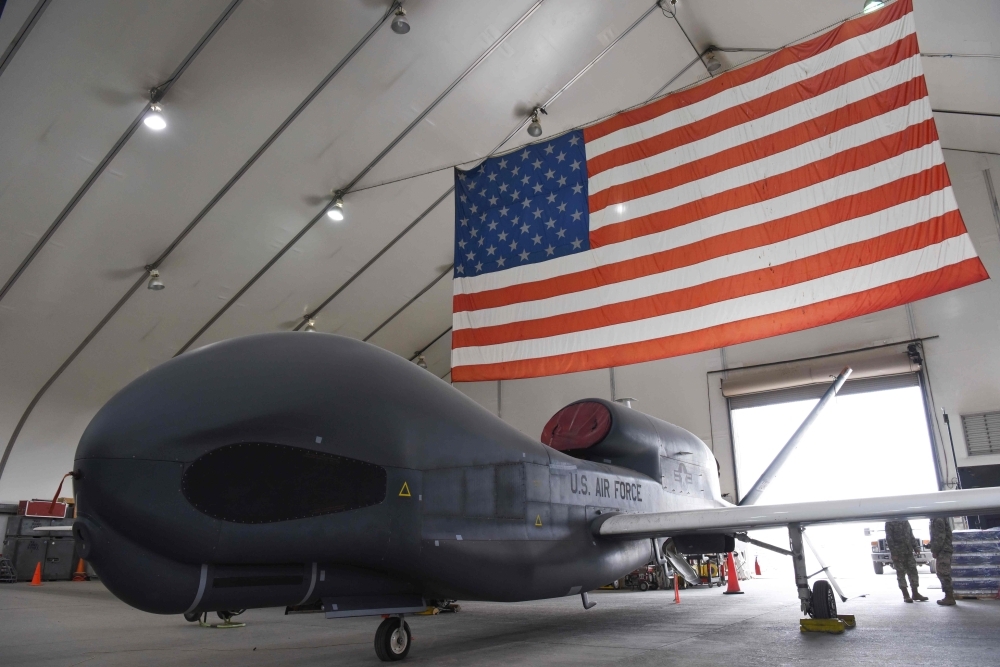 In this image released by the US Air Force, RQ-4 Global Hawk unmanned surveillance sits in a hangar on Feb. 17, 2019, at Al Dhafra Air Base, United Arab Emirates. The Pentagon confirmed on Thursday, that Iranian forces shot down a US naval surveillance drone but insisted the aircraft was in international air space, not that of Iran. — AFP