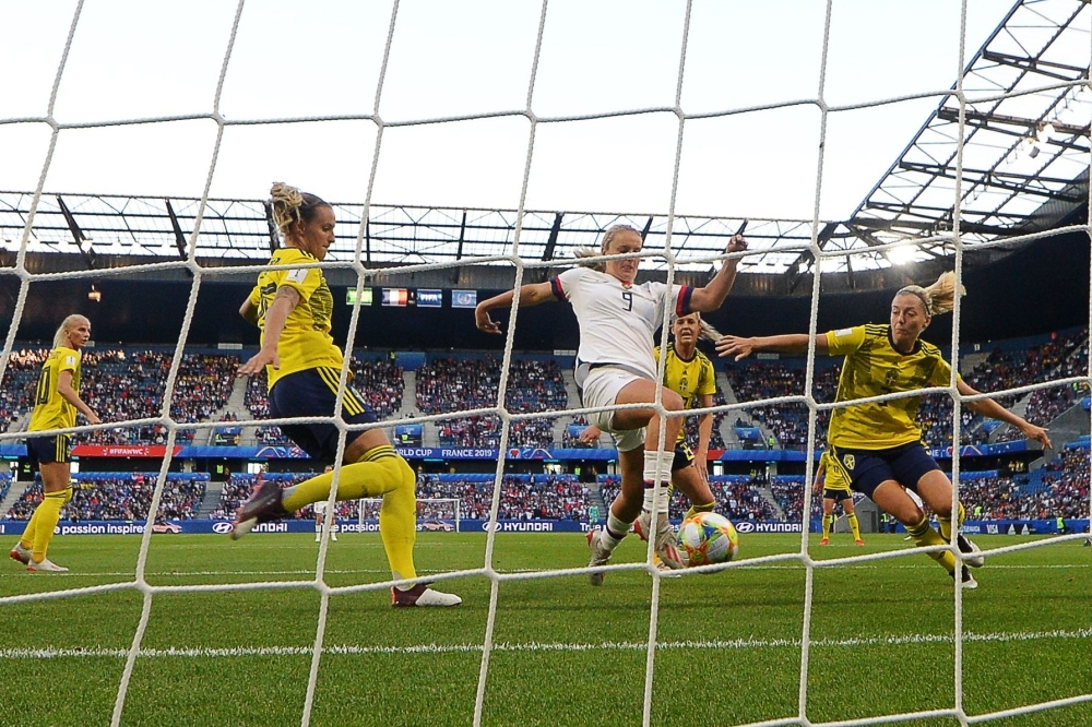 United States' midfielder Lindsey Horan (C) scores the opening goal during the France 2019 Women's World Cup Group F football match between Sweden and USA, on Thursday at the Oceane Stadium in Le Havre, northwestern France. — AFP