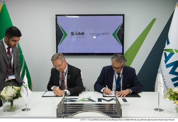 Representatives of  Saudi Arabian Military Industries Company (SAMI) and France's Figeac Aero sign the agreement in Paris on Friday.