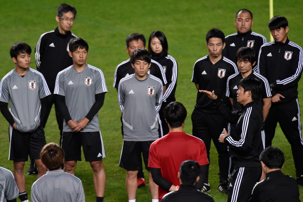 Japan's coach Hajime Moriyasu (R) speaks to the players during a training session at the Independencia stadium, in Belo Horizonte, Brazil, on Friday during the Copa America football tournament. — AFP