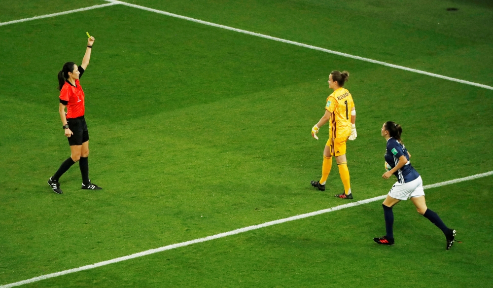 Scotland's Lee Alexander is shown a yellow card by referee referee Ri Hyang-ok during the Women's World Cup Group D tie against Argentina at the Parc des Princes, Paris, France, Wednesday. — Reuters