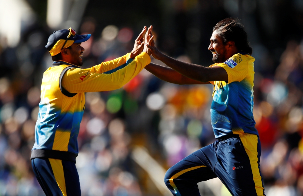 Sri Lanka's Nuwan Pradeep celebrates taking the wicket of England's Mark Wood and winning the ICC Cricket World Cup match at the Headingley, Leeds, Britiain, on Friday. — Reuters