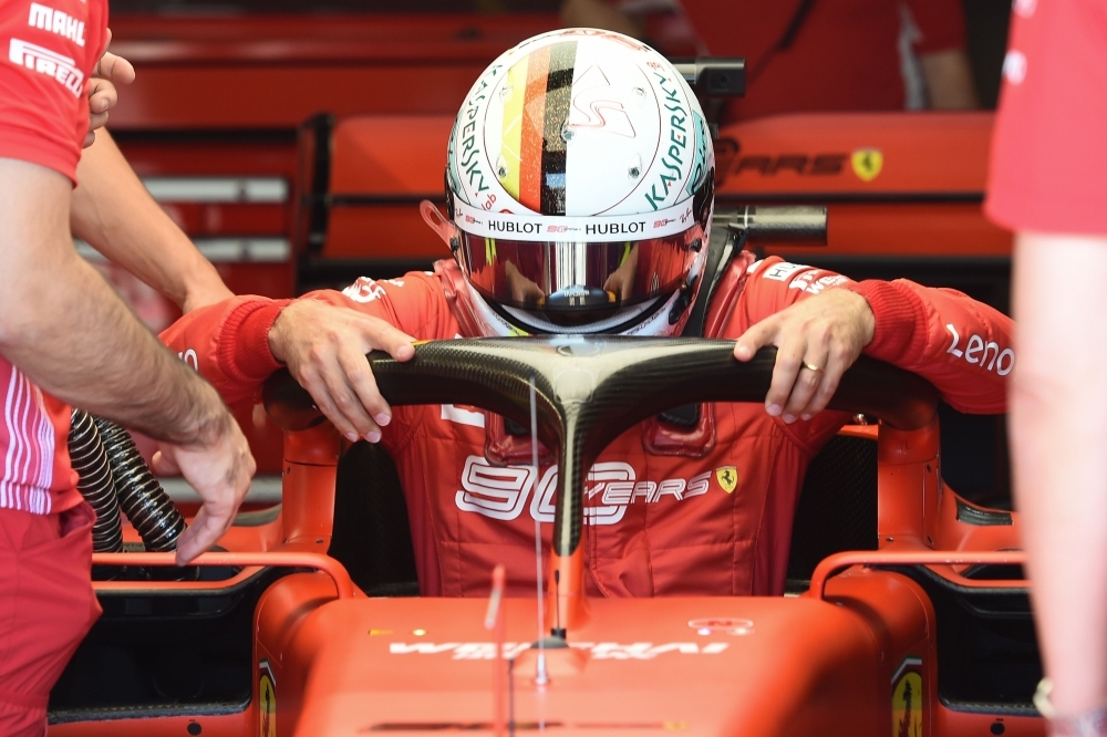 Ferrari's German driver Sebastian Vettel gets into his car in the pits for the third practice session at the Circuit Paul Ricard in Le Castellet, southern France, on Saturday ahead of the Formula One Grand Prix de France. — AFP