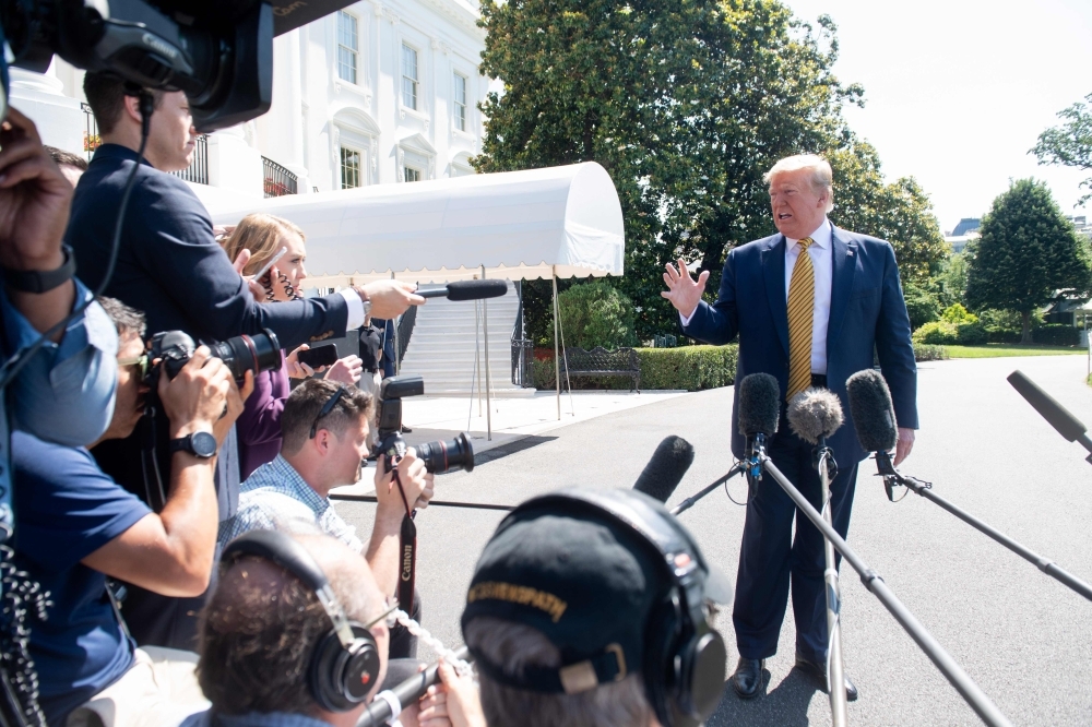 US President Donald Trump speaks to the media prior to departing on Marine One from the South Lawn of the White House in Washington, DC, Saturday, as he travels to Camp David, Maryland. — AFP