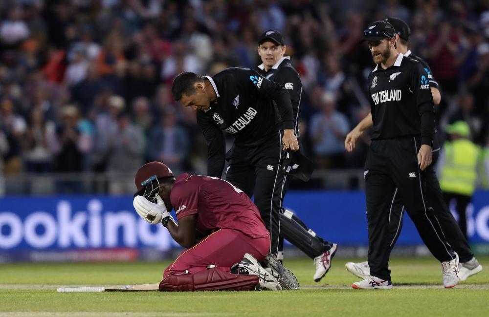 West Indies' Carlos Brathwaite looks dejected after losing his wicket and the match against New Zealand in the ICC Cricket World Cup match at the Old Trafford, Manchester, Britain, on Saturday. — Reuters