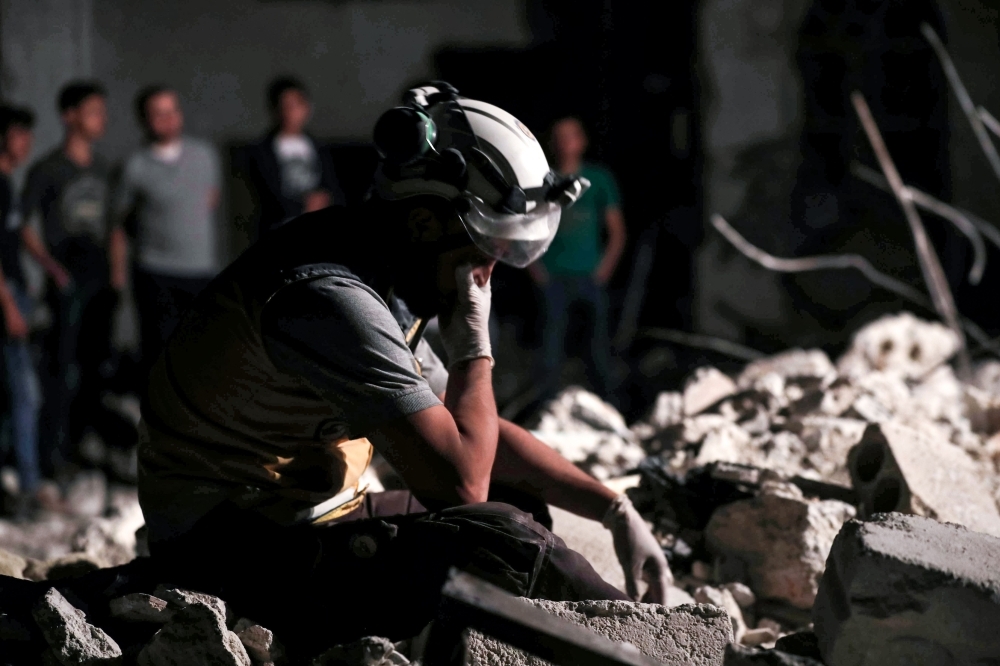 A member of the Syrian Civil Defense, also known as the 