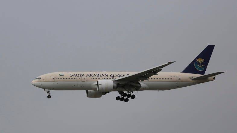 A passenger aircraft of the Saudi Arabian Airlines prepares for landing.