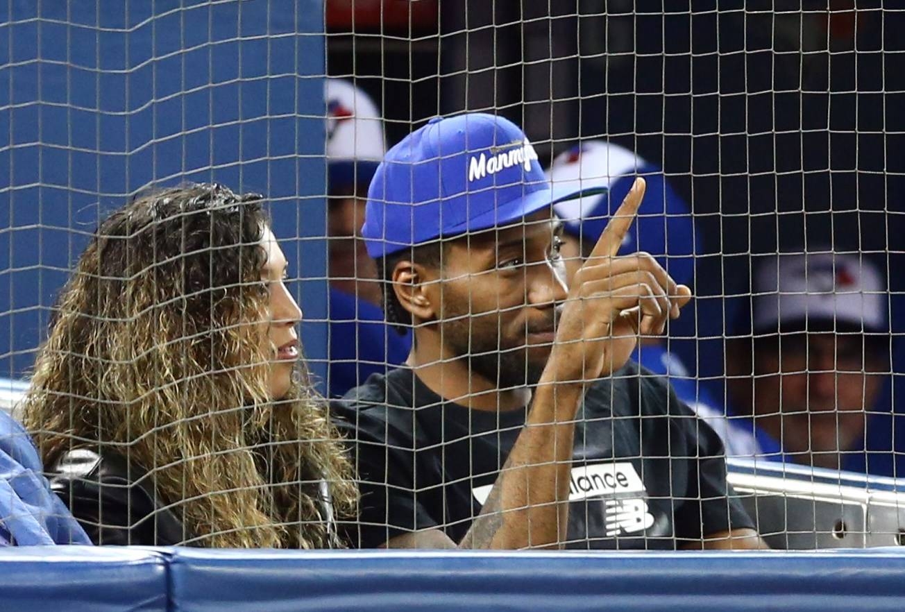 Kawhi Leonard of the Toronto Raptors acknowledges the crowd as he watches a MLB game between the Los Angeles Angels of Anaheim and the Toronto Blue Jays at Rogers Center on Friday in Toronto, Canada.   — AFP
