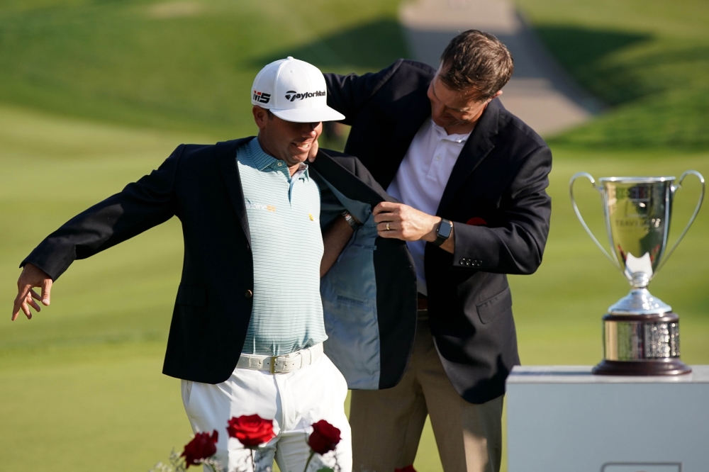 Chez Reavie of the United States poses with the trophy after winning the Travelers Championship at TPC River Highlands on Sunday in Cromwell, Connecticut. — AFP