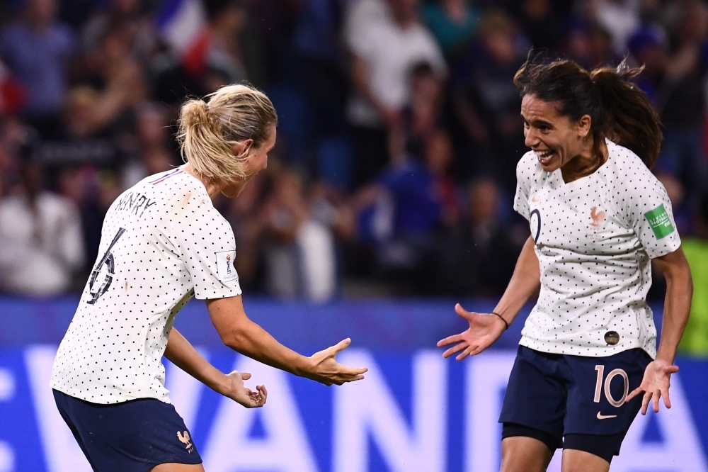 France's midfielder Amandine Henry (C) scores her team's second goal during the France 2019 Women's World Cup round of sixteen football match against Brazil, on Sunday, at the Oceane stadium in Le Havre, north western France. — AFP