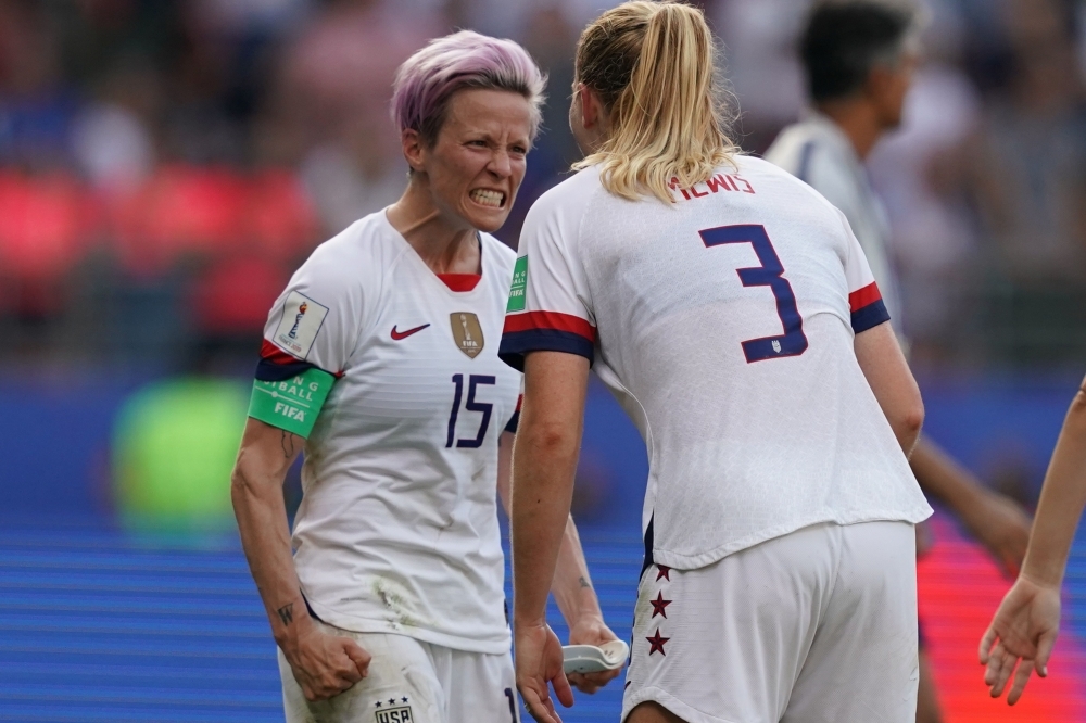 United States' forward Megan Rapinoe (L) and United States' midfielder Sam Mewis celebrate at the end of the France 2019 Women's World Cup round of sixteen football match against Spain on Monday, at the Auguste-Delaune stadium in Reims, northern France. — AFP 