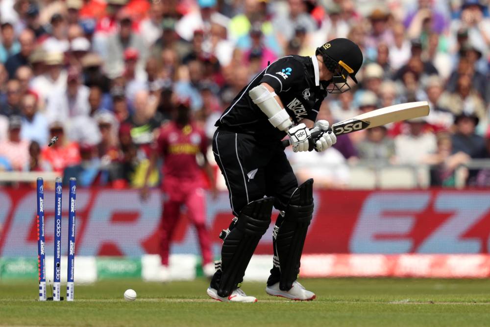  Colin Munro is bowled by West Indies' Sheldon Cottrell in the ICC Cricket World Cup  match at the Old Trafford, Manchester, Britain on Saturday. — Reuters