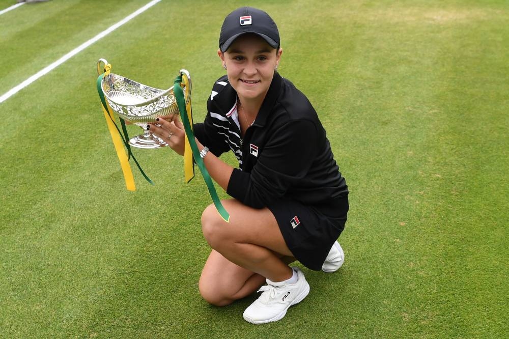 Australia's Ashleigh Barty poses for a photograph with the trophy after her straight sets victory over Germany's Julia Gorges in their women's singles final tennis match at the WTA Nature Valley Classic tournament at Edgbaston Priory Club in Birmingham, central England on Sunday. — AFP