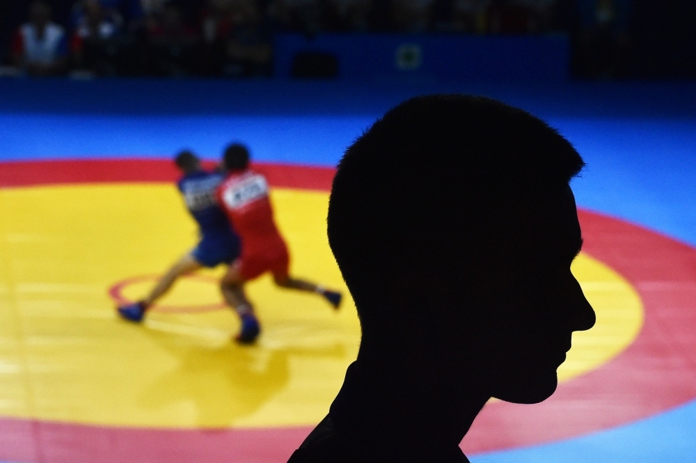 Spectators watch sambo competitions at the 2019 European Games in Minsk on Sunday. With elements of judo, karate, boxing, Greco-Roman wrestling and more, sambo was created to train the forces of the Soviet Union and is still taught in the Russian army. The combat sport, which dates back to 1930, has caught attention this month as part of the European Games in Minsk. Now its backers are targeting the 2024 Olympic Games in Paris. — AFP