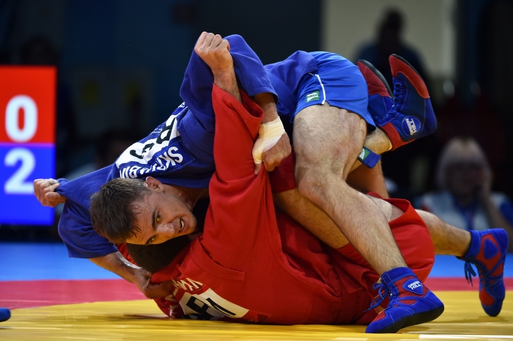 Spectators watch sambo competitions at the 2019 European Games in Minsk on Sunday. With elements of judo, karate, boxing, Greco-Roman wrestling and more, sambo was created to train the forces of the Soviet Union and is still taught in the Russian army. The combat sport, which dates back to 1930, has caught attention this month as part of the European Games in Minsk. Now its backers are targeting the 2024 Olympic Games in Paris. — AFP