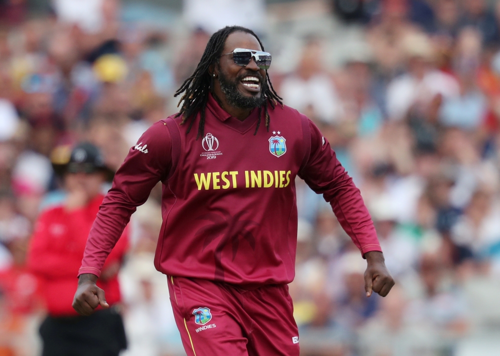 West Indies's Chris Gayle celebrates taking the wicket of New Zealand's Ross Taylor during the ICC Cricket World Cup match at Old Trafford, Manchester, Britain on Saturday. — Reuters