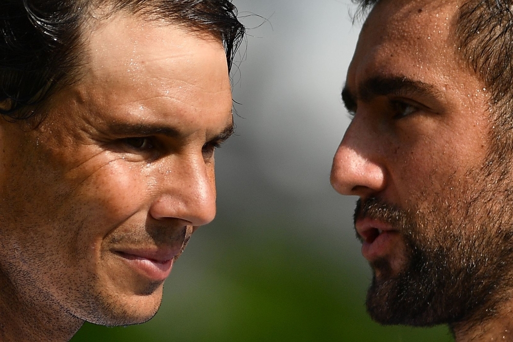 Croatia's Marin Cilic (R) speaks with Spain's Rafael Nadal after winning their men's singles match at The Aspall Tennis Classic tournament at the Hurlingham Club in London on Wednesday. — AFP