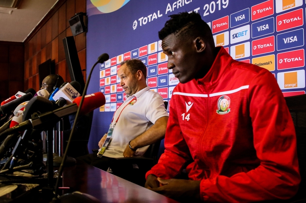 Kenya's coach Sebastian Migne (C) and Kenya's forward Michael Olunga (R) attend a press conference at the 30 June Stadium in Cairo on Wednesday, on the eve of the 2019 Africa Cup of Nations (CAN) football match between Kenya and Tanzania. — AFP