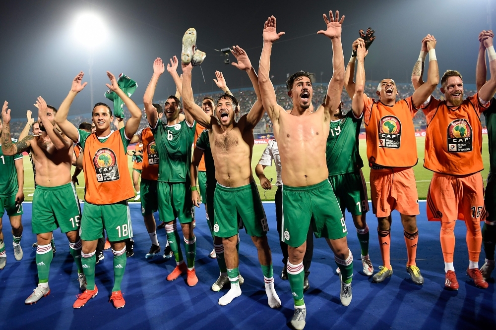 Algerian players celebrate after winning the 2019 Africa Cup of Nations (CAN) football match against Senegal at the June 30 Stadium in Cairo on Thursday.  — AFP