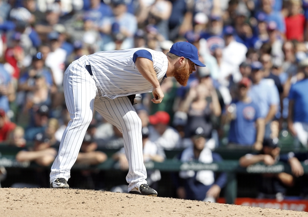 Craig Kimbrel No. 24 of the Chicago Cubs pitches in the ninth inning during the game against the Atlanta Braves at Wrigley Field on Thursday in Chicago, Illinois. — AFP