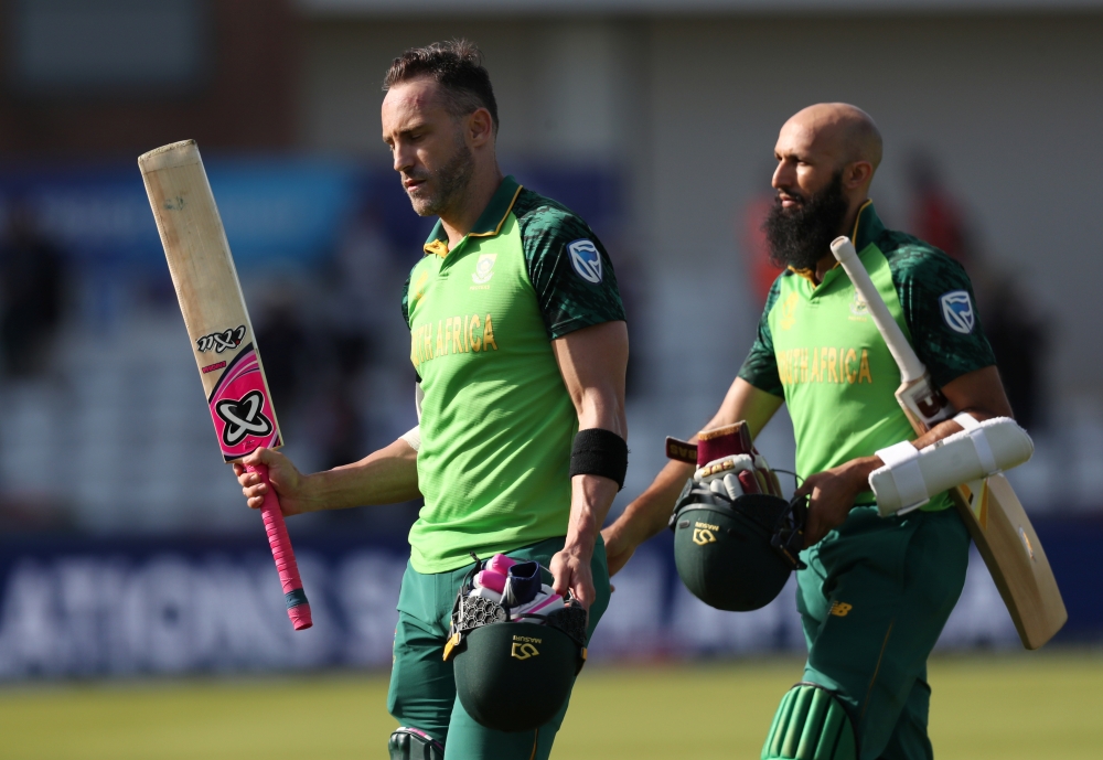  South Africa's Faf du Plessis and Hashim Amla walk off after winning the ICC Cricket World Cup match against Sri Lanka at the Emirates Riverside, Chester-Le-Street, Britain on Friday. — Reuters