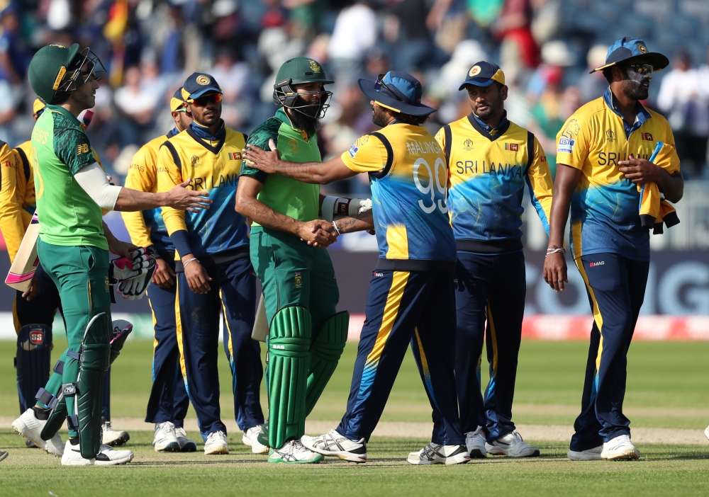  South Africa's Faf du Plessis and Hashim Amla walk off after winning the ICC Cricket World Cup match against Sri Lanka at the Emirates Riverside, Chester-Le-Street, Britain on Friday. — Reuters