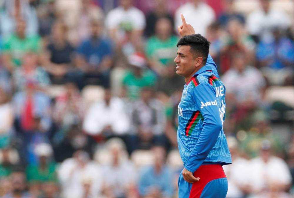 Afghanistan's Mujeeb Ur Rahman celebrates after dismissing Bangladesh's Shakib Al Hasan during the Cricket World Cup match at  The Ageas Bowl, Southampton, Britain on Monday. — Reuters