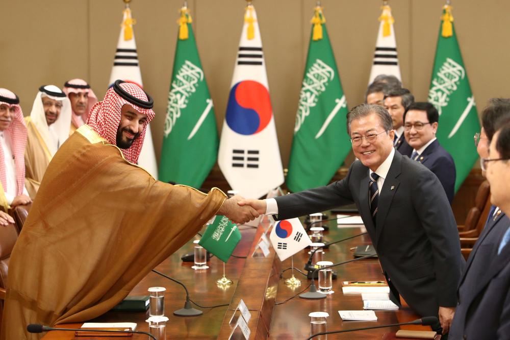 Crown Prince Muhammad Bin Salman shakes hands with South Korean President Moon Jae-In during a meeting at the Presidential Blue House in Seoul on June 26, 2019. — AFP