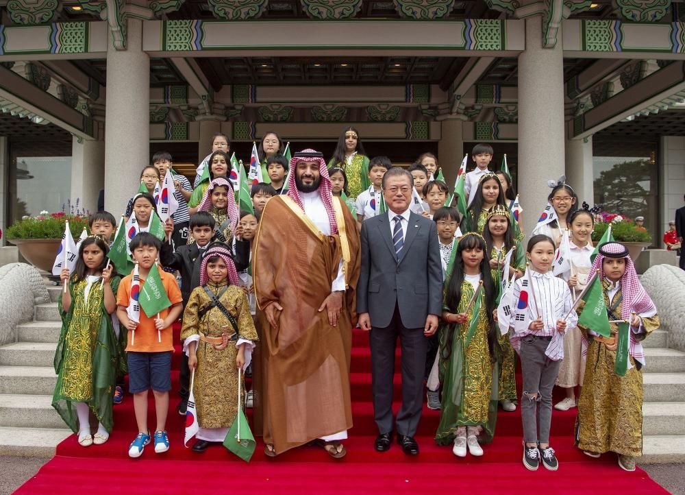 Crown Prince Muhammad Bin Salman shakes hands with South Korean President Moon Jae-In during a meeting at the Presidential Blue House in Seoul on June 26, 2019. — AFP