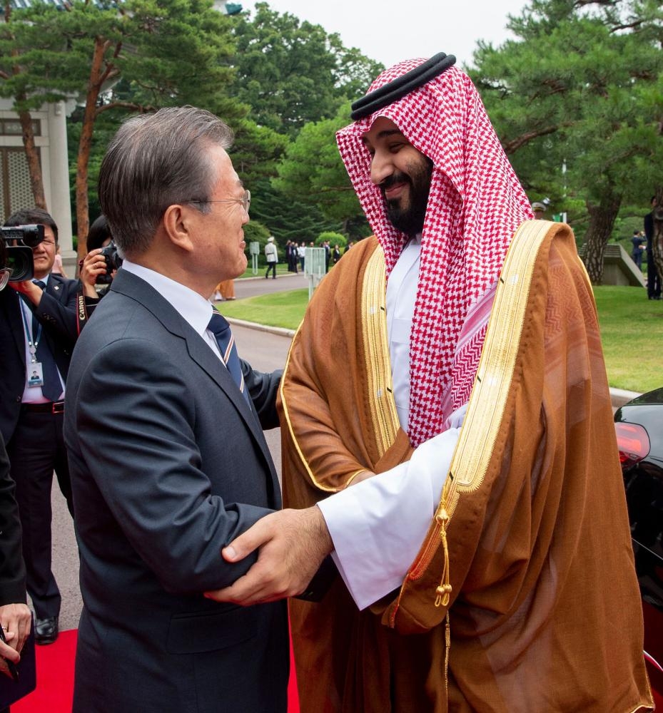 Crown Prince Muhammad Bin Salman shakes hands with South Korean President Moon Jae-In during a meeting at the Presidential Blue House in Seoul on June 26, 2019. — AFP