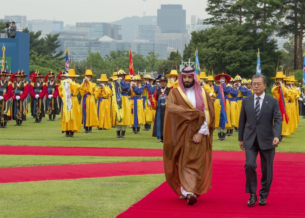 Crown Prince Muhammad Bin Salman shakes hands with South Korean President Moon Jae-In during a meeting at the Presidential Blue House in Seoul on June 26, 2019. — AFP