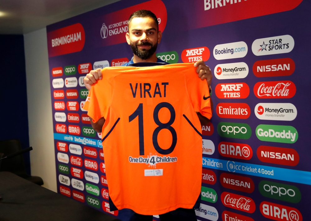 India's Virat Kohli poses with his shirt during a ICC Cricket World Cup press conference at Edgbaston, Birmingham, Britain on Saturday. — Reuters