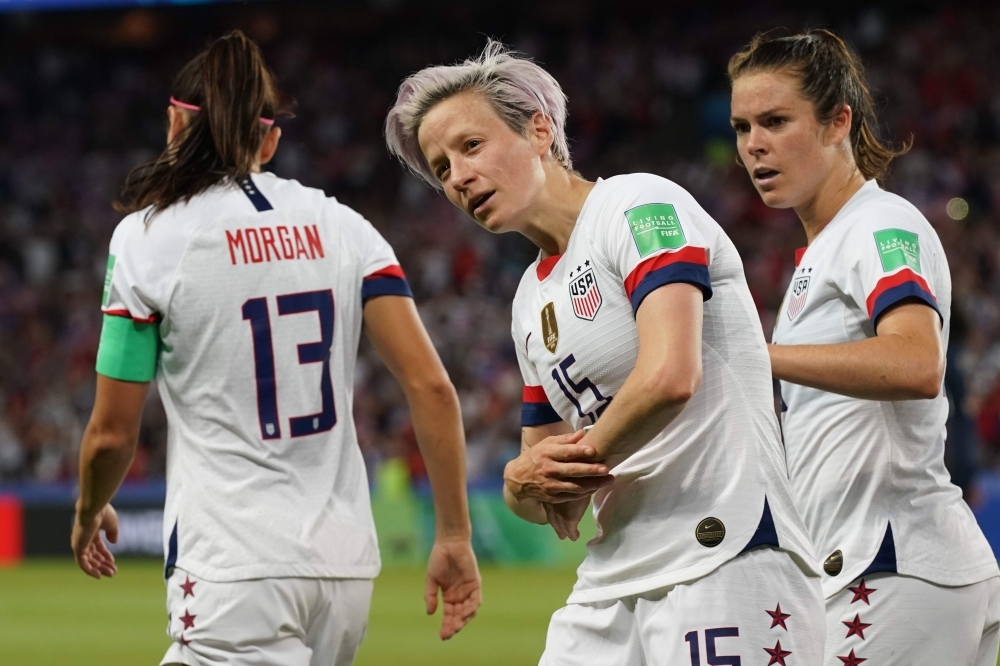 United States' forward Megan Rapinoe (C) vies with France's forward Kadidiatou Diani (R) during the France 2019 Women's World Cup quarterfinal football match between France and USA, on Friday, at the Parc des Princes stadium in Paris. — AFP